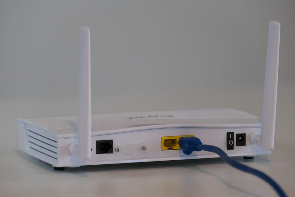 Wireless router and ethernet connection representing Wi-Fi 7 versus Wi-Fi 6E networks